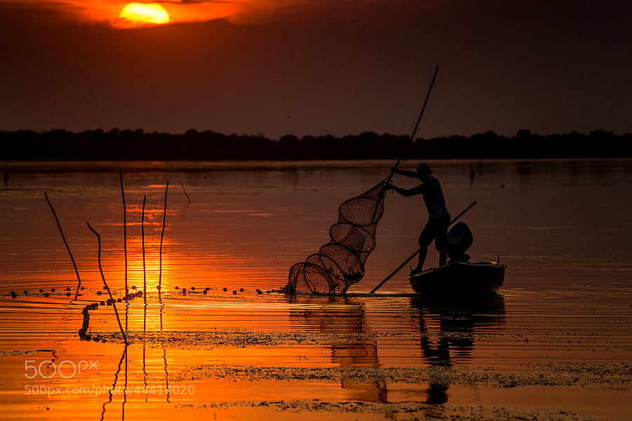 Photograph Fisherman at sunset by Radu Dumitrescu-Elian on 500px