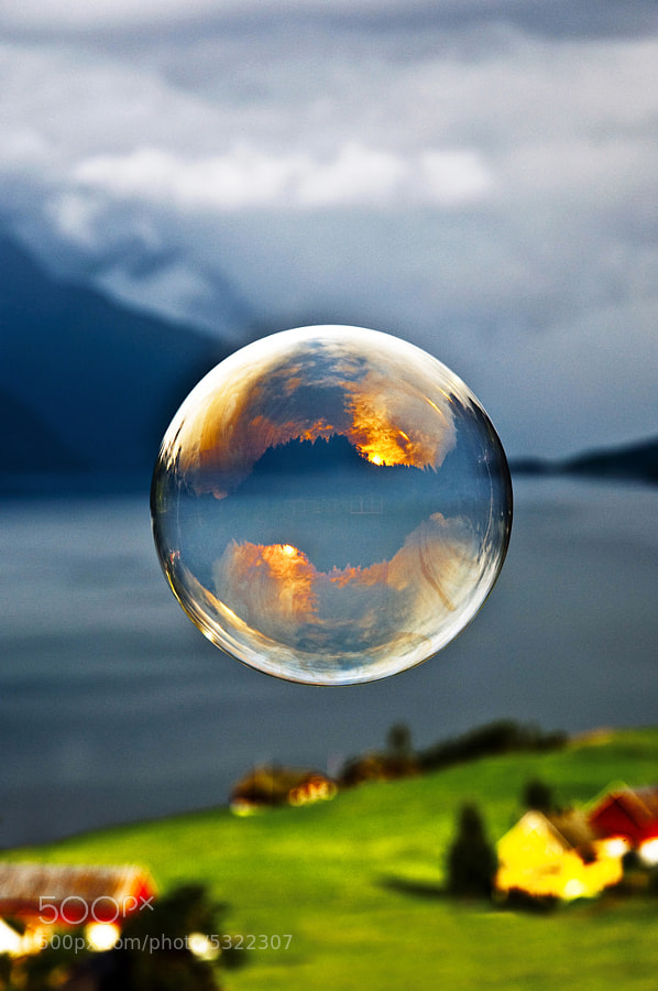 Photograph Morning light reflected in a soap bubble over the fjord by Odin Hole Standal on 500px