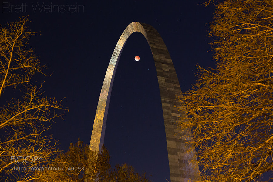 Photograph Eclipse Under the Arch by Brett Weinstein on 500px