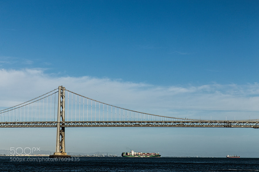 Photograph Bay Bridge and Container Ship by John Mazzei on 500px